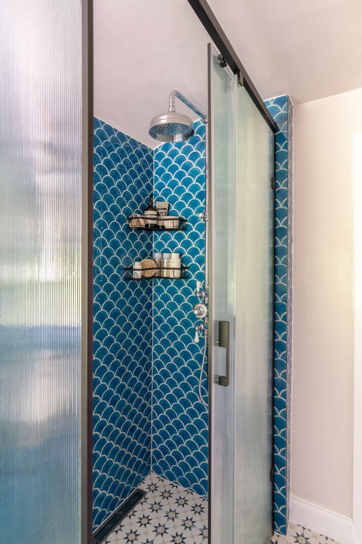 Blue Tones in a Two-Bedroom Victorian Cottage 14 bathroom shower blue tiles