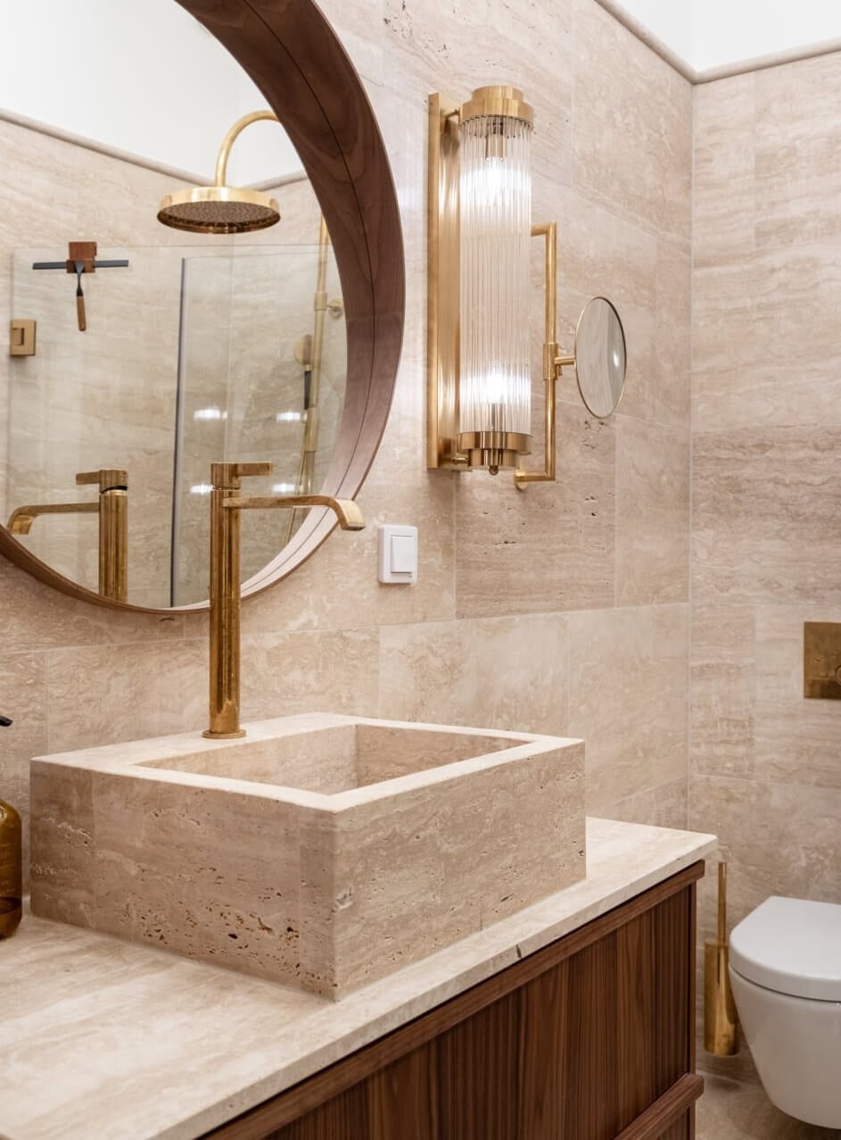 A Luxurious Stockholm Apartment with Period Features 22 bathroom sink and round mirror