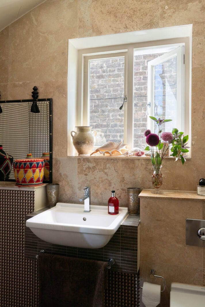 A Moody Color Palette and Eclectic Interiors in a London Apartment 16 bathroom soapstone tiles nordroom