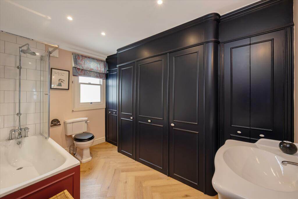 Cottage-style Interiors in a London Family Home 19 bathroom with black storage