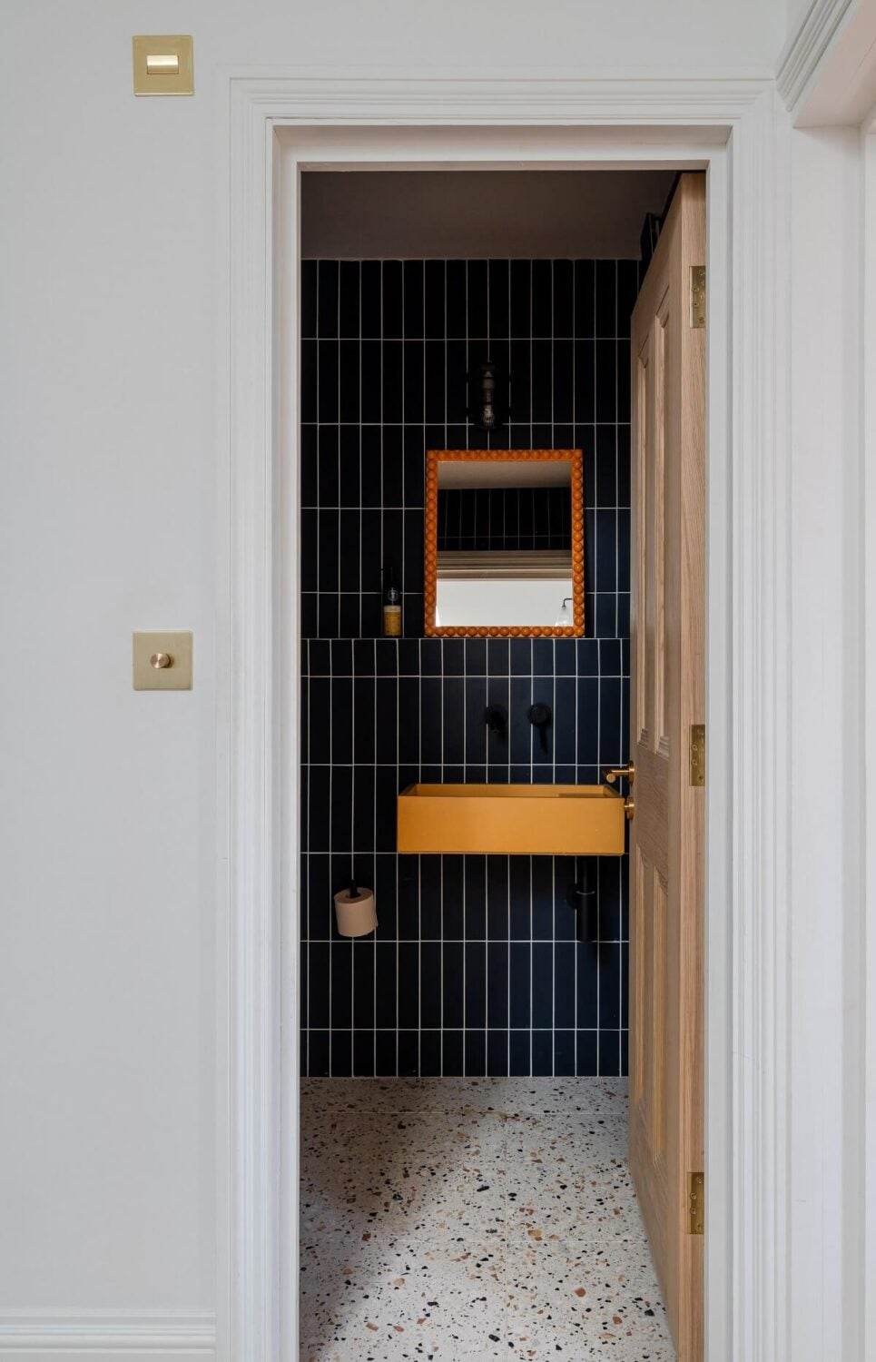 A Stunning Color Palette in an Extended Edwardian House in London 29 bathroom with dark blue tiles