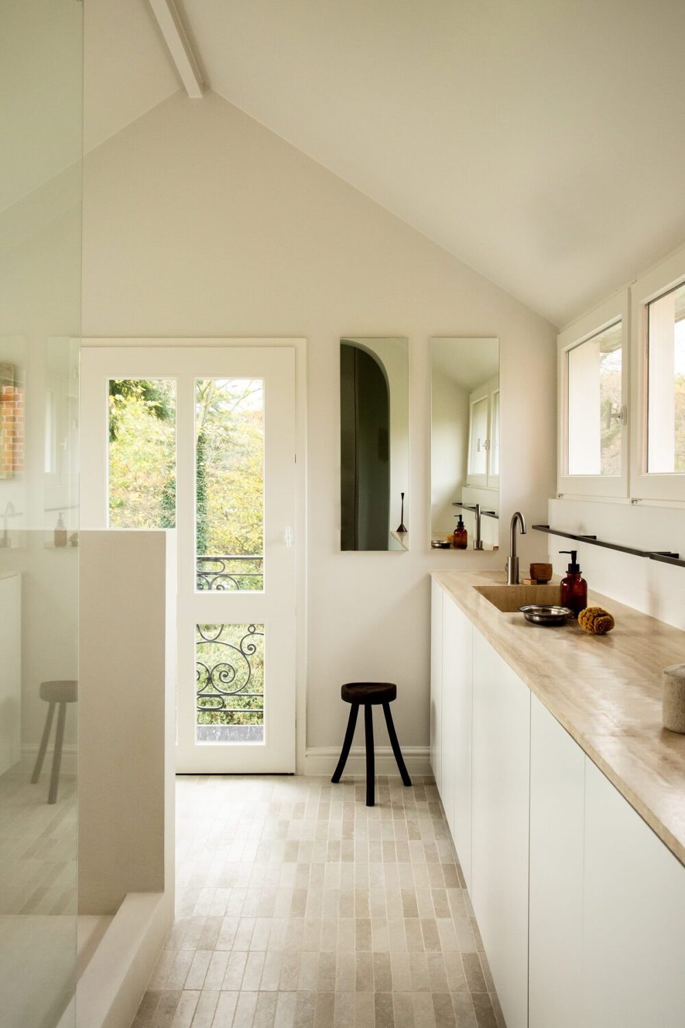 Historic Character and Timeless Elegant Interiors in a Restored Belgian Villa 32 bathroom with pitched ceiling