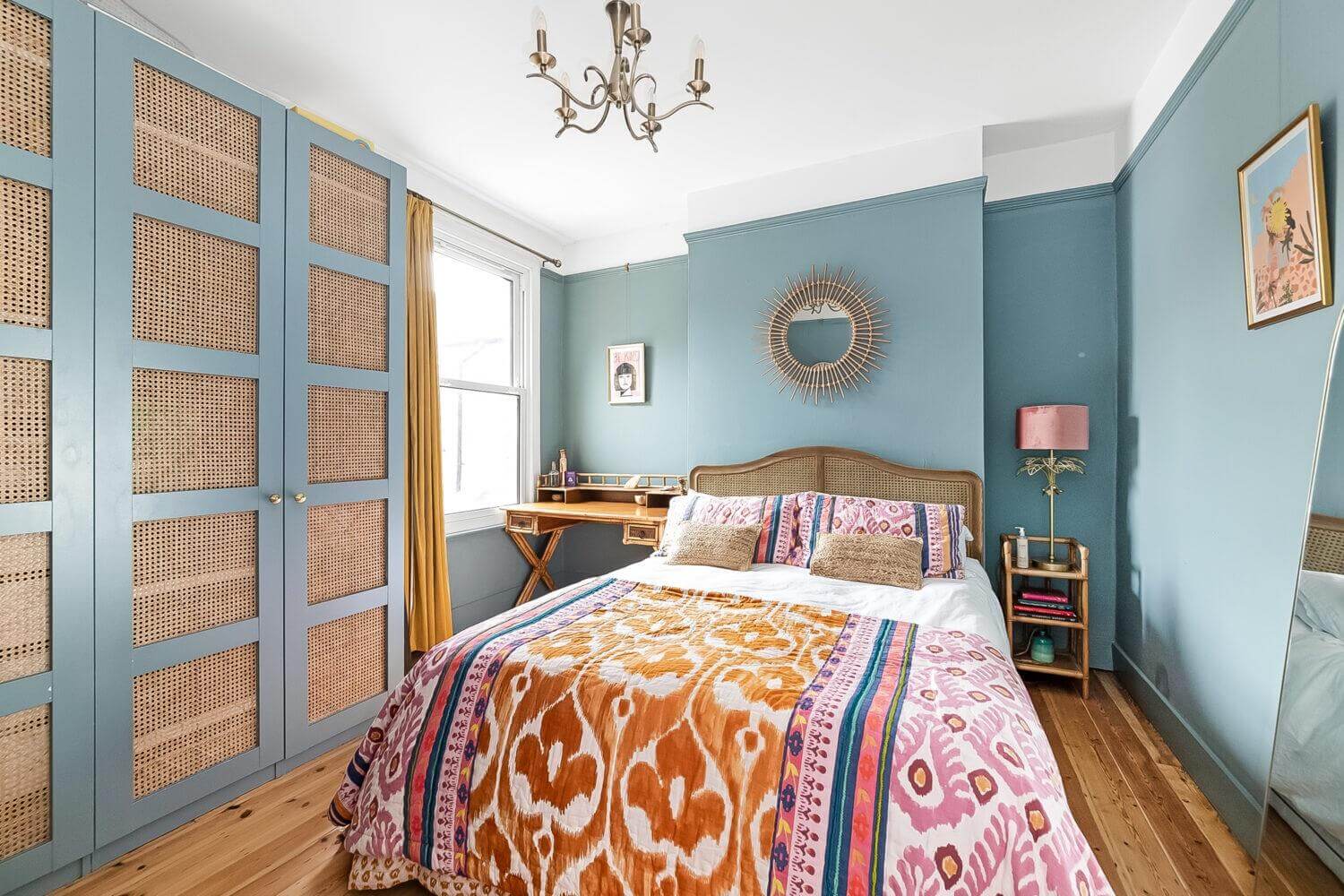Playful Materials, Textures, and Colors in a London Home 17 bedroom bedroom with wardrobes with cane doors