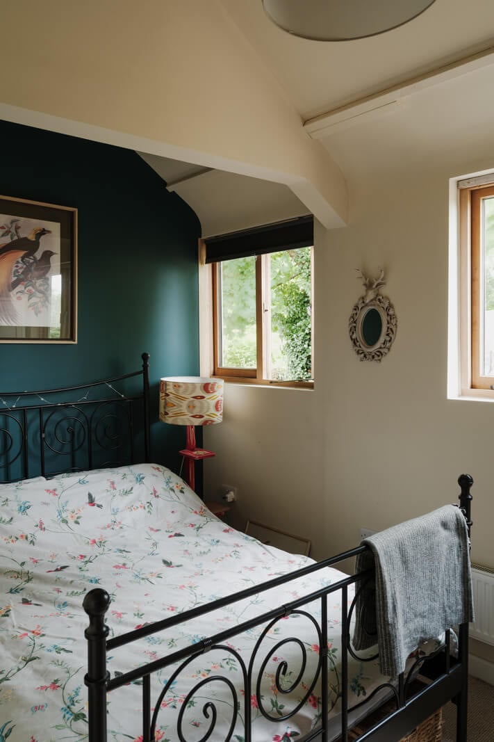 A Black Barn House with Boho Interiors and Breathtaking Views 11 bedroom blue wall