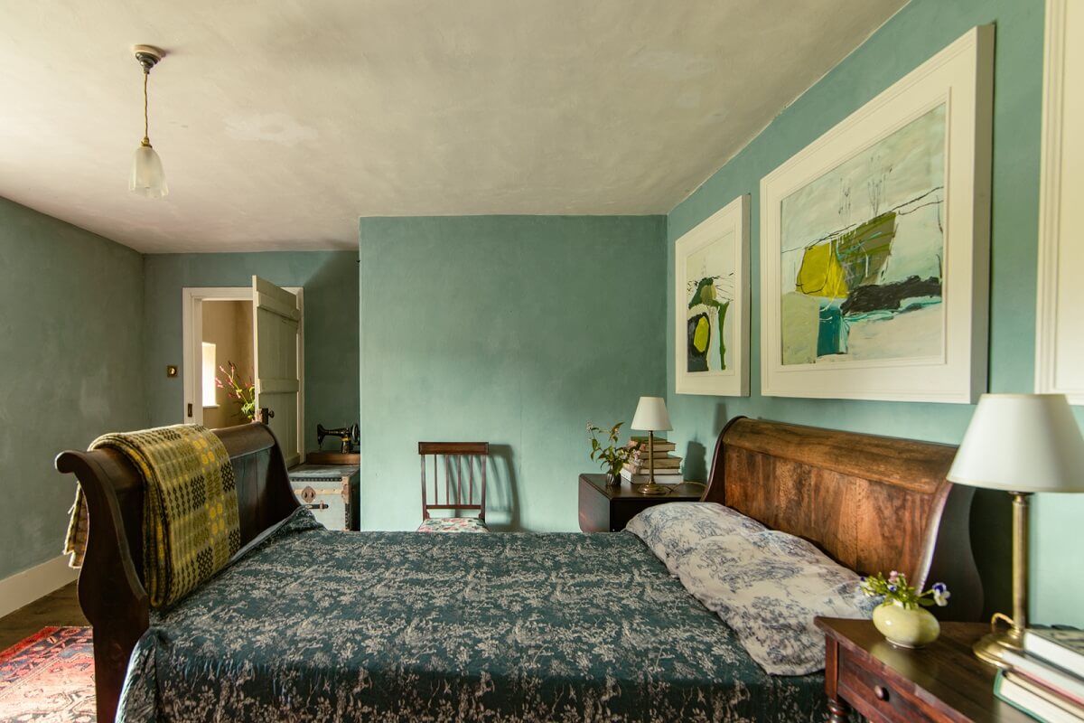 A Yellow Farmhouse with Bold Color Pops in Wales 14 bedroom light blue walls