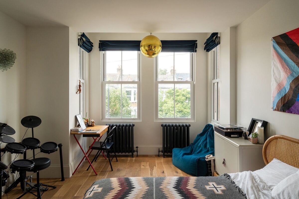 A Stunning Color Palette in an Extended Edwardian House in London 28 bedroom with bay window