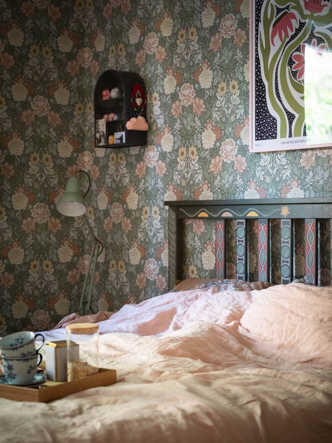 Floral Wallpaper and a Pink Kitchen in a Midcentury Apartment 17 bedroom with floral wallpaper and painted bedframe nordroom