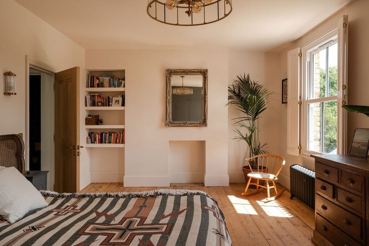 A Stunning Color Palette in an Extended Edwardian House in London 18 bedroom with natural light and wooden floor