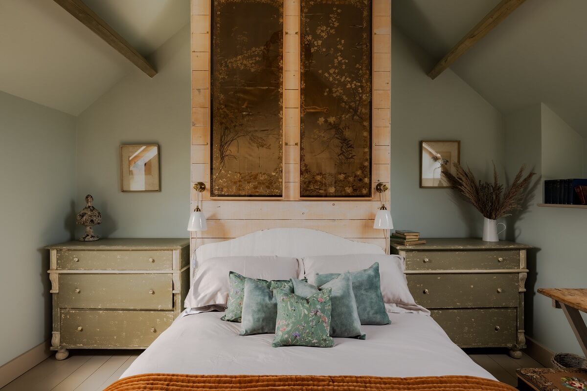Cottage-Style Interiors in an English Barn Conversion 11 bedroom with ochre throw and pitched ceiling