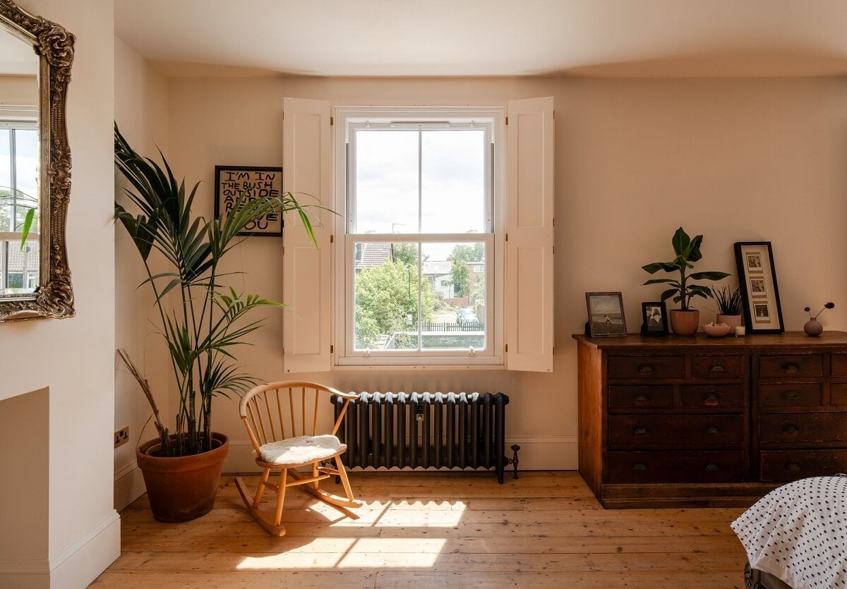 A Stunning Color Palette in an Extended Edwardian House in London 21 bedroom with original wooden floor and window shutters nordroom