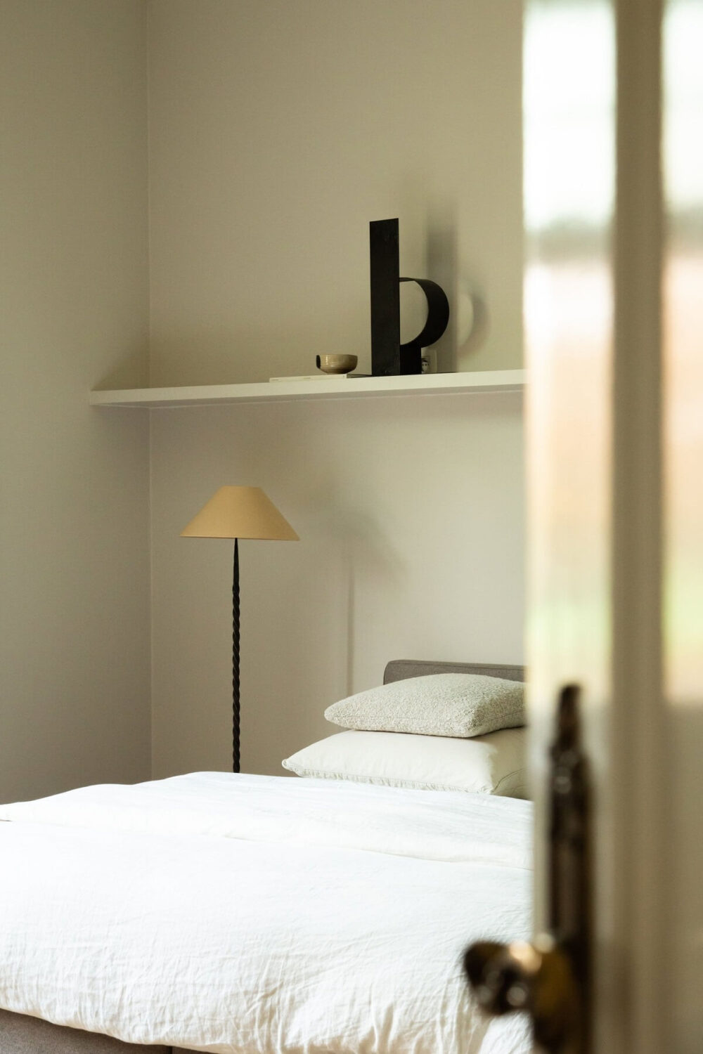 Historic Character and Timeless Elegant Interiors in a Restored Belgian Villa 21 bedroom with shelf above bed