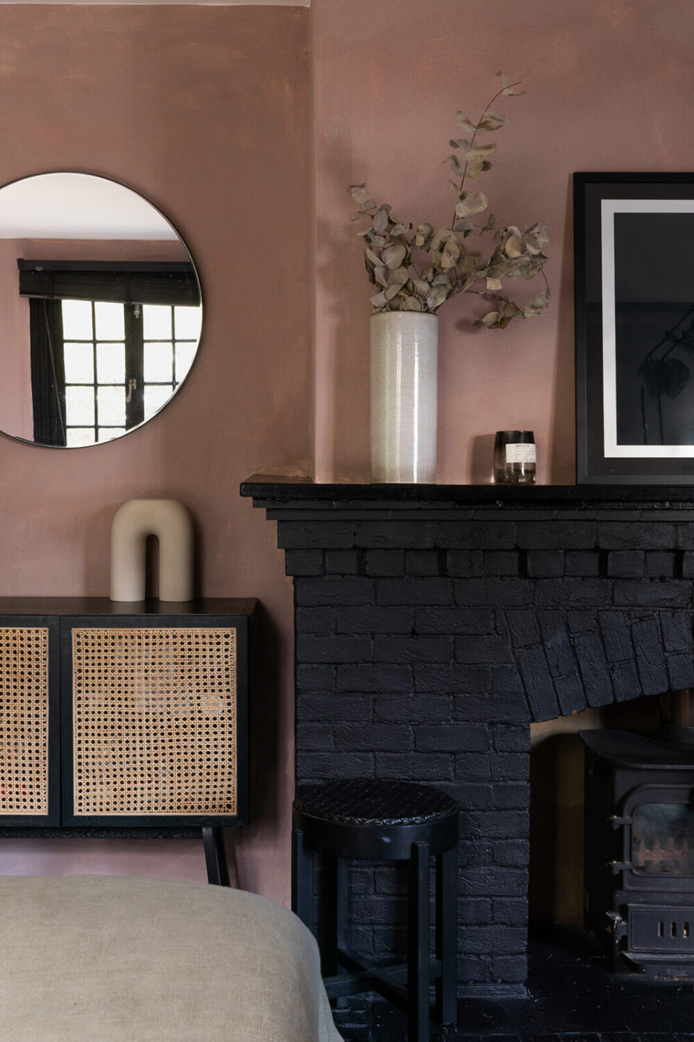 10 Easy Budget-Friendly Upgrades To Boost Your Home's Appeal 7 black painted brick fireplace and pink wall nordroom
