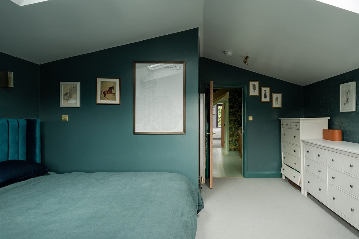 Exposed Materials and Green Tones in a London Stable Conversion 12 blue bedroom