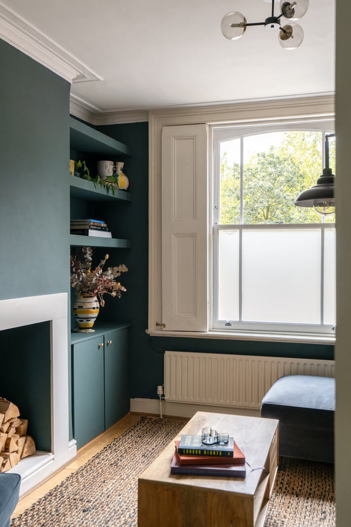 Blue Tones in a Two-Bedroom Victorian Cottage 3 blue living room shelves