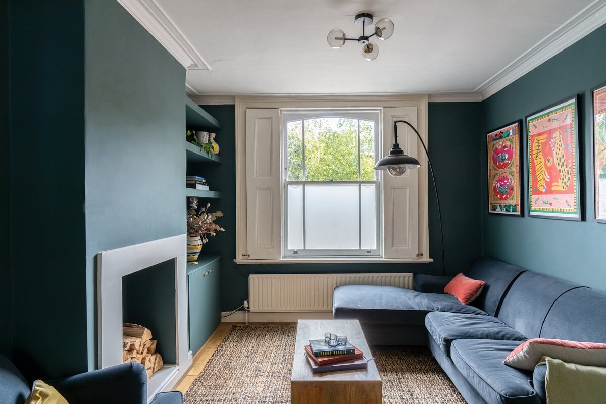 Blue Tones in a Two-Bedroom Victorian Cottage 2 blue sitting room with fireplace