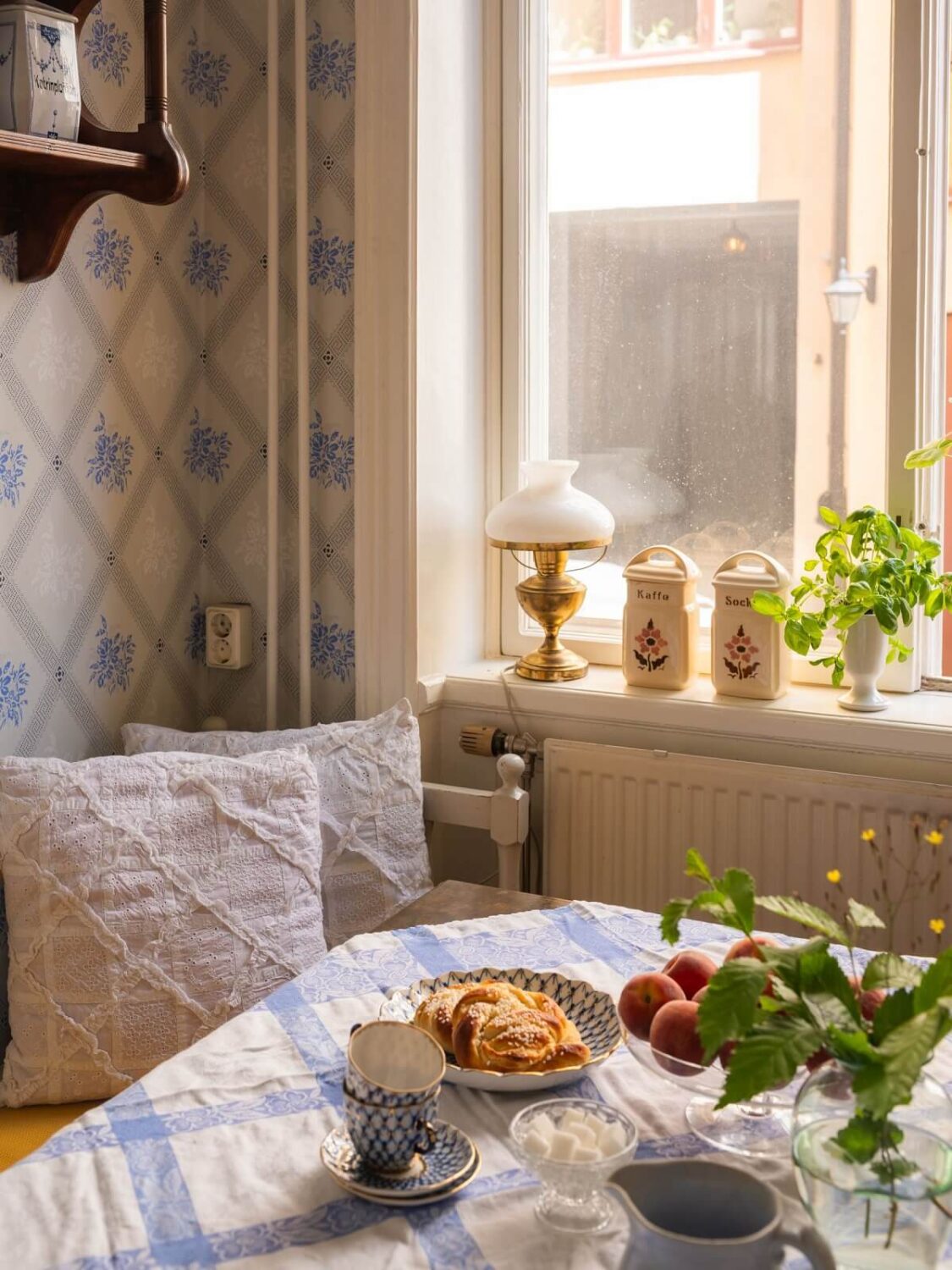 Antique Furniture and Arched Windows in a Stockholm Apartment 12 breakfast nook blue wallpaper