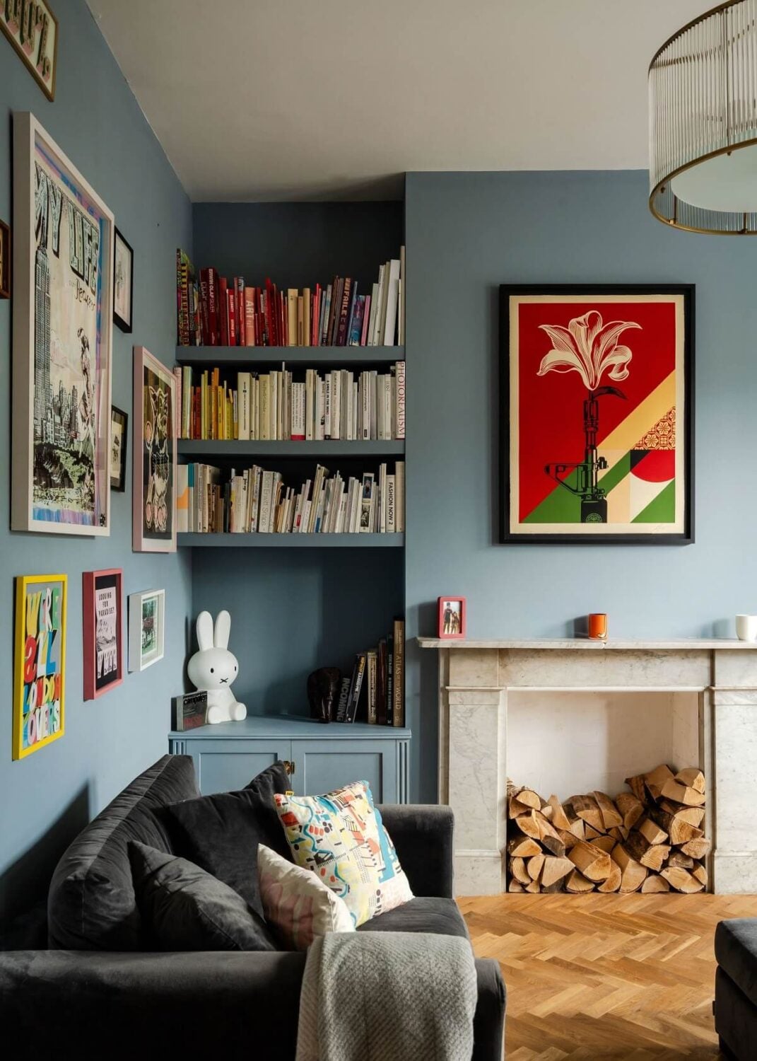 A Stunning Color Palette in an Extended Edwardian House in London 2 built in bookshelves in blue living room with fireplace nordroom