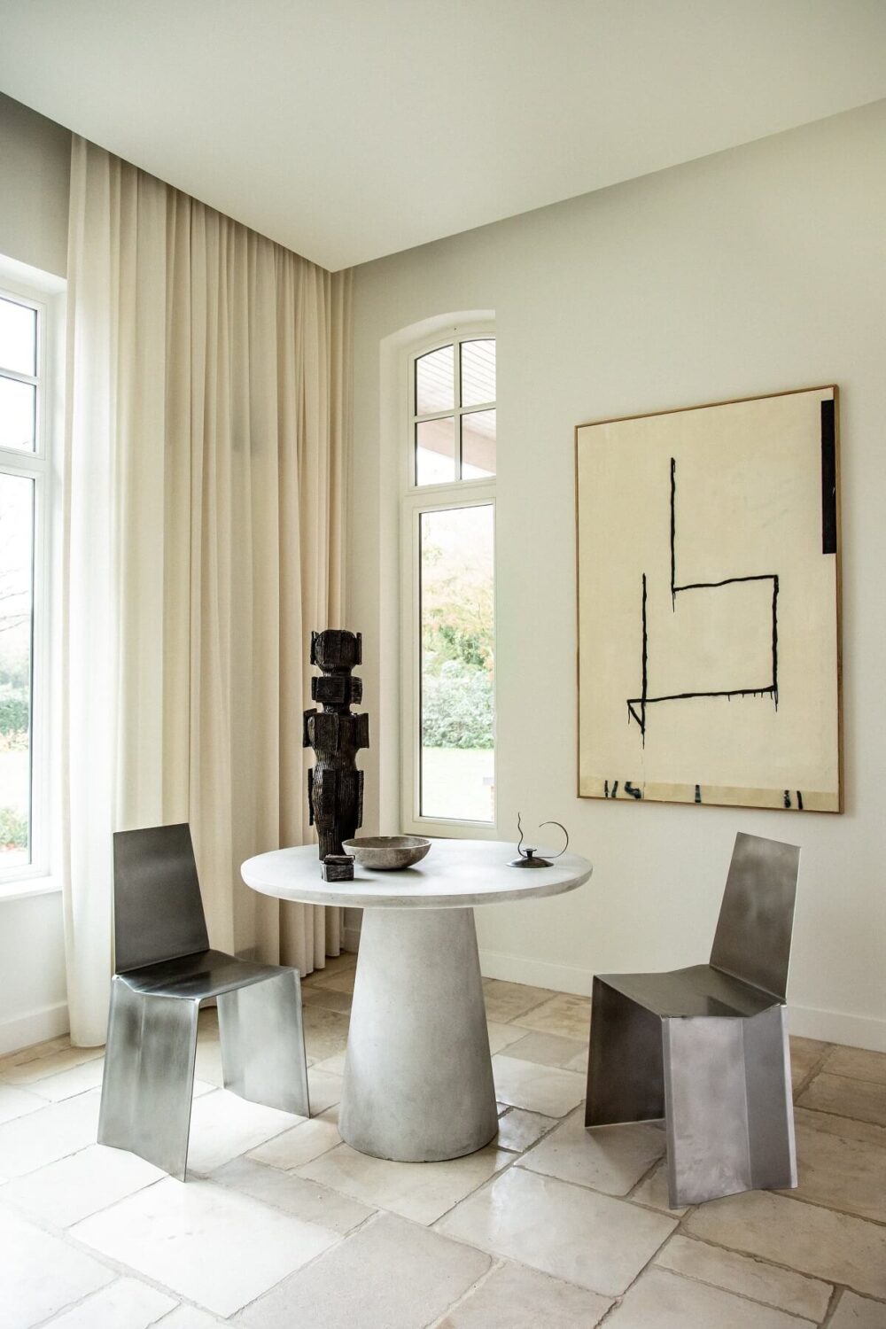Historic Character and Timeless Elegant Interiors in a Restored Belgian Villa 12 contemporary design round table artwork