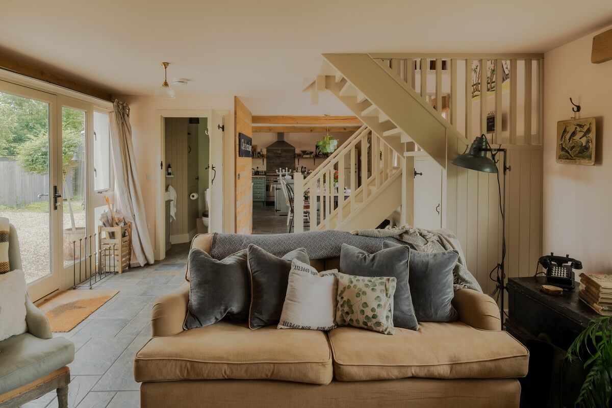 Cottage-Style Interiors in an English Barn Conversion 3 cottage living room with stair