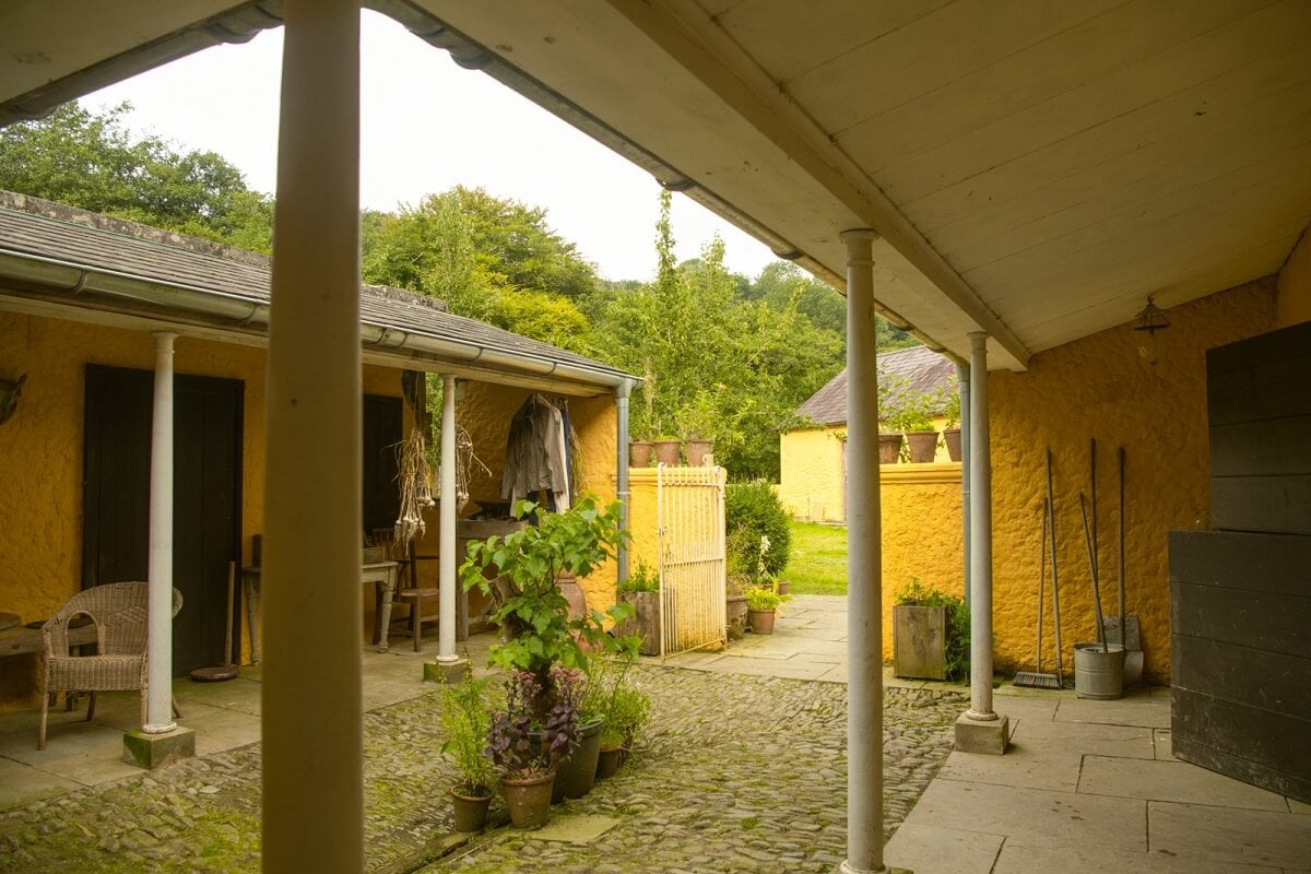 A Yellow Farmhouse with Bold Color Pops in Wales 26 courtyard yellow farmhouse