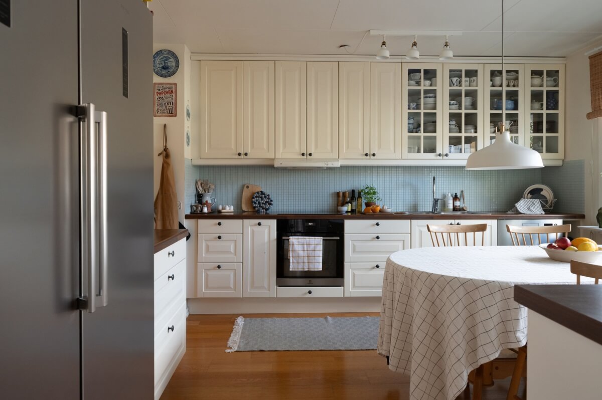 A Swedish Family Home with a Lovely Garden Room 5 cream colored kitchen