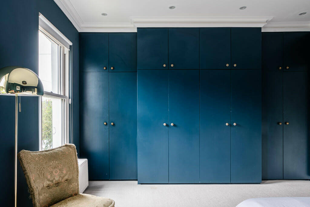 An Open Plan Victorian House with a Lush Green Garden 8 dark blue bedroom built in wardrobes An Open Plan Victorian House with a Lush Green Garden