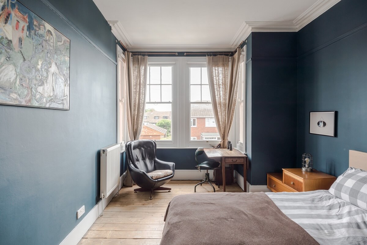 Pared-Back Interiors in a Late Victorian House 11 dark blue bedroom