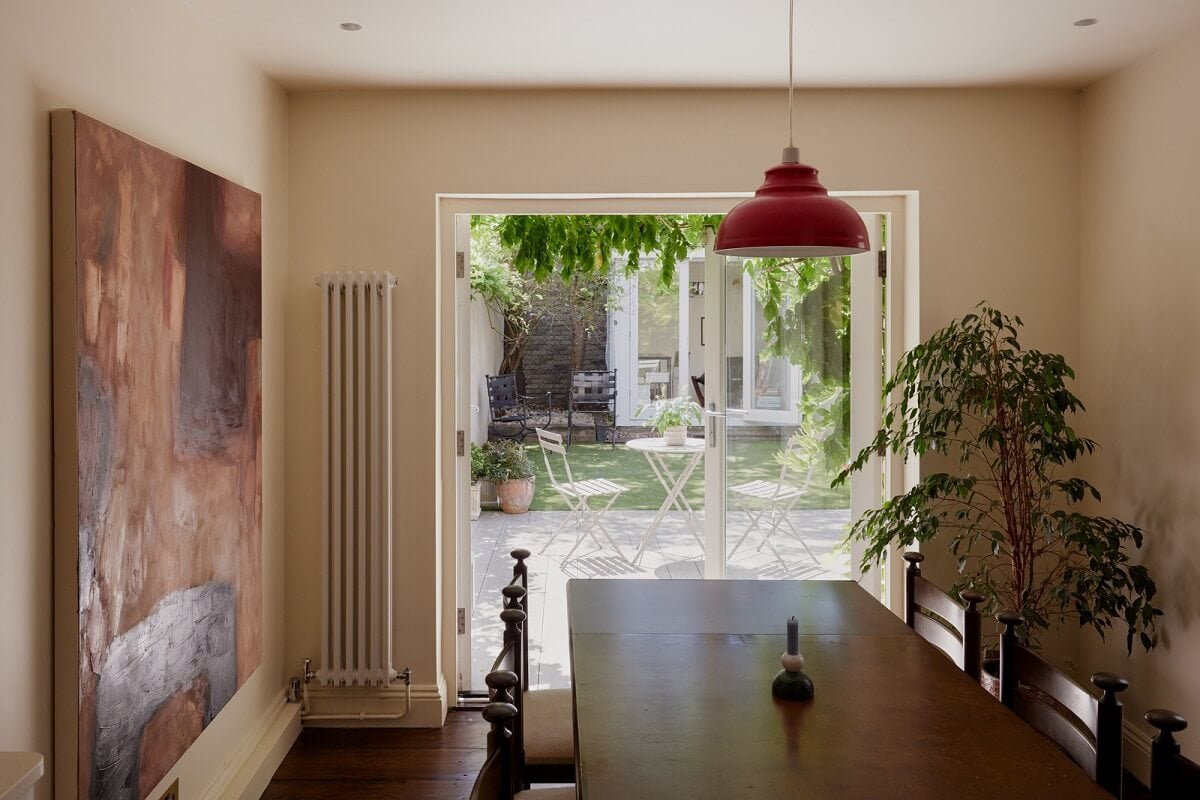 A Charming London House with an Ochre Yellow Bedroom 5 dining room with garden