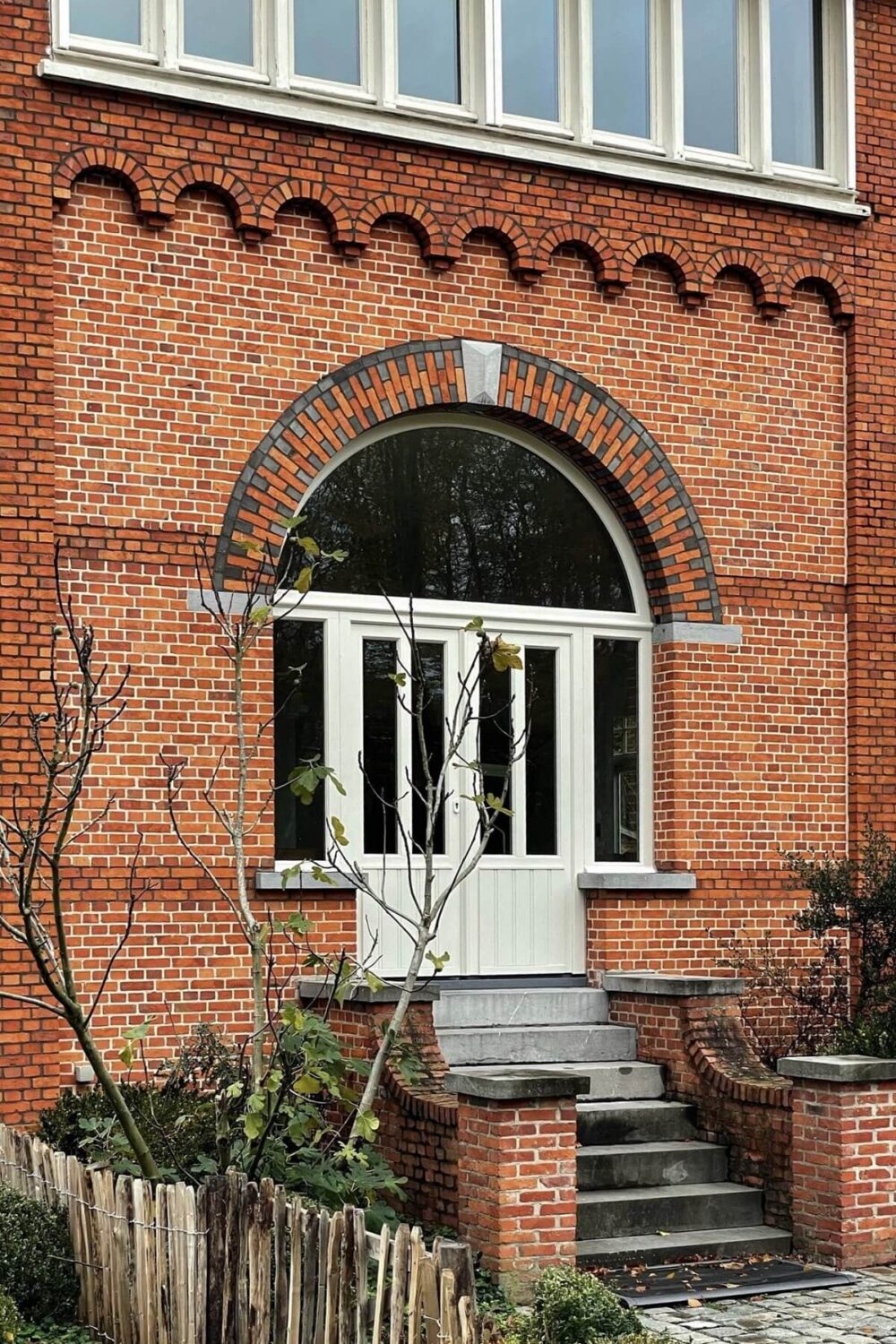 Historic Character and Timeless Elegant Interiors in a Restored Belgian Villa 34 double doors to garden arched window