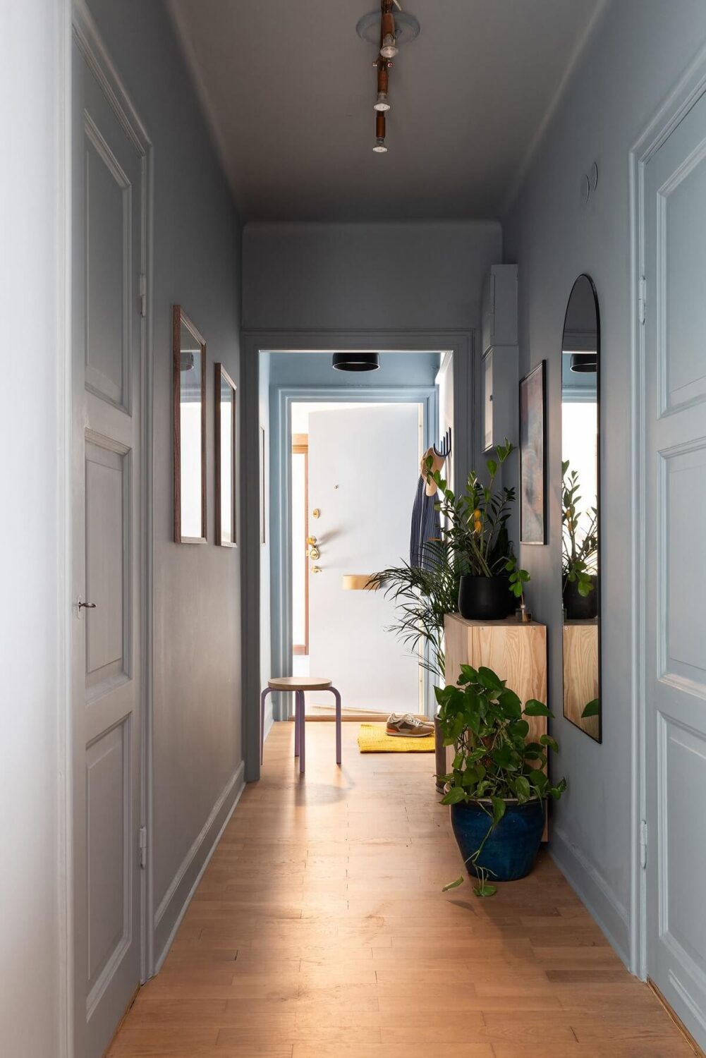 A Renovated Stockholm Apartment with Subtle Color Details 27 egg blue hallway A Renovated Stockholm Apartment with Subtle Color Details