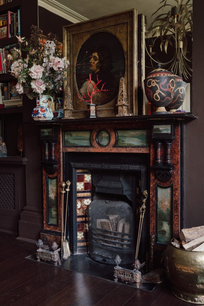 A Moody Color Palette and Eclectic Interiors in a London Apartment 6 fireplace detail