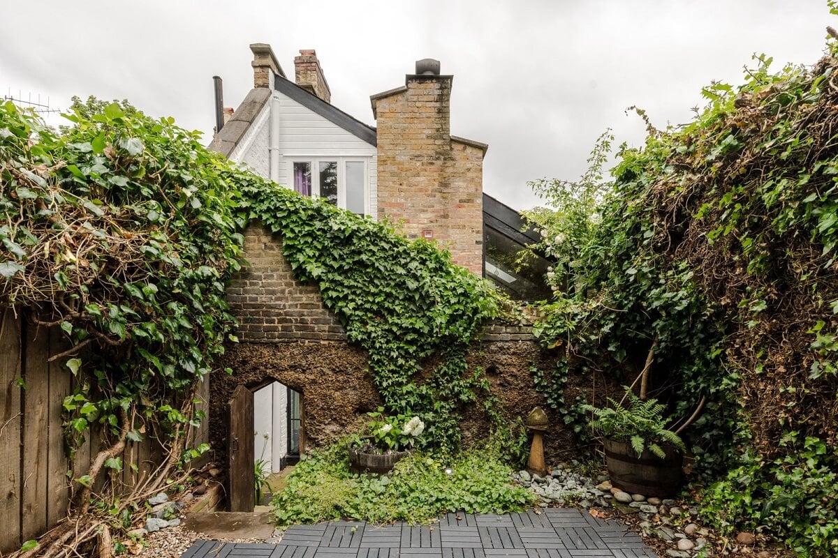 Exposed Materials and Green Tones in a London Stable Conversion 19 garden