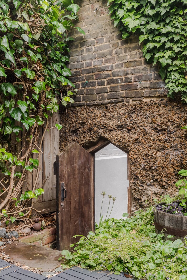 Exposed Materials and Green Tones in a London Stable Conversion 18 garden entry