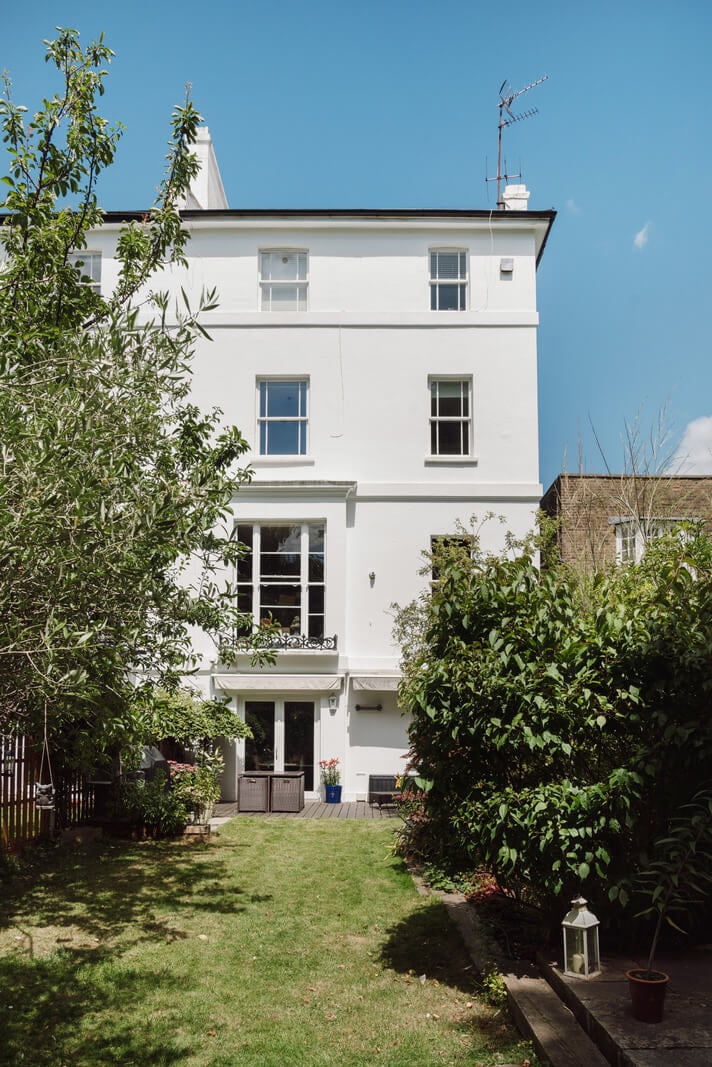 A Moody Color Palette and Eclectic Interiors in a London Apartment 19 garden white stucco building A Moody Color Palette and Eclectic Interiors in a London Apartment