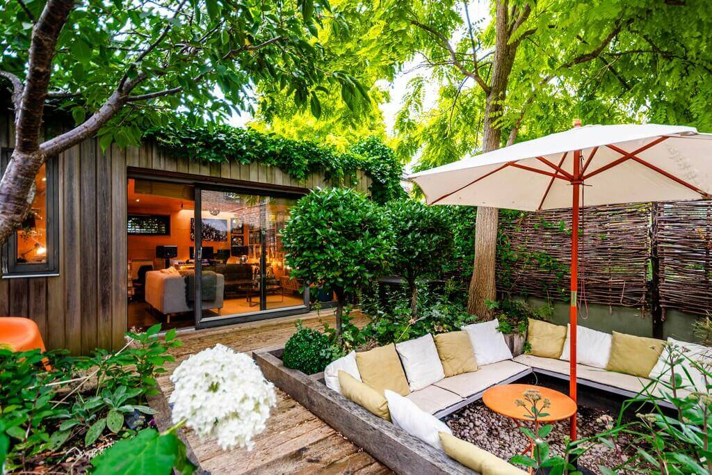 An Open Plan Victorian House with a Lush Green Garden 13 garden with sunken seating An Open Plan Victorian House with a Lush Green Garden