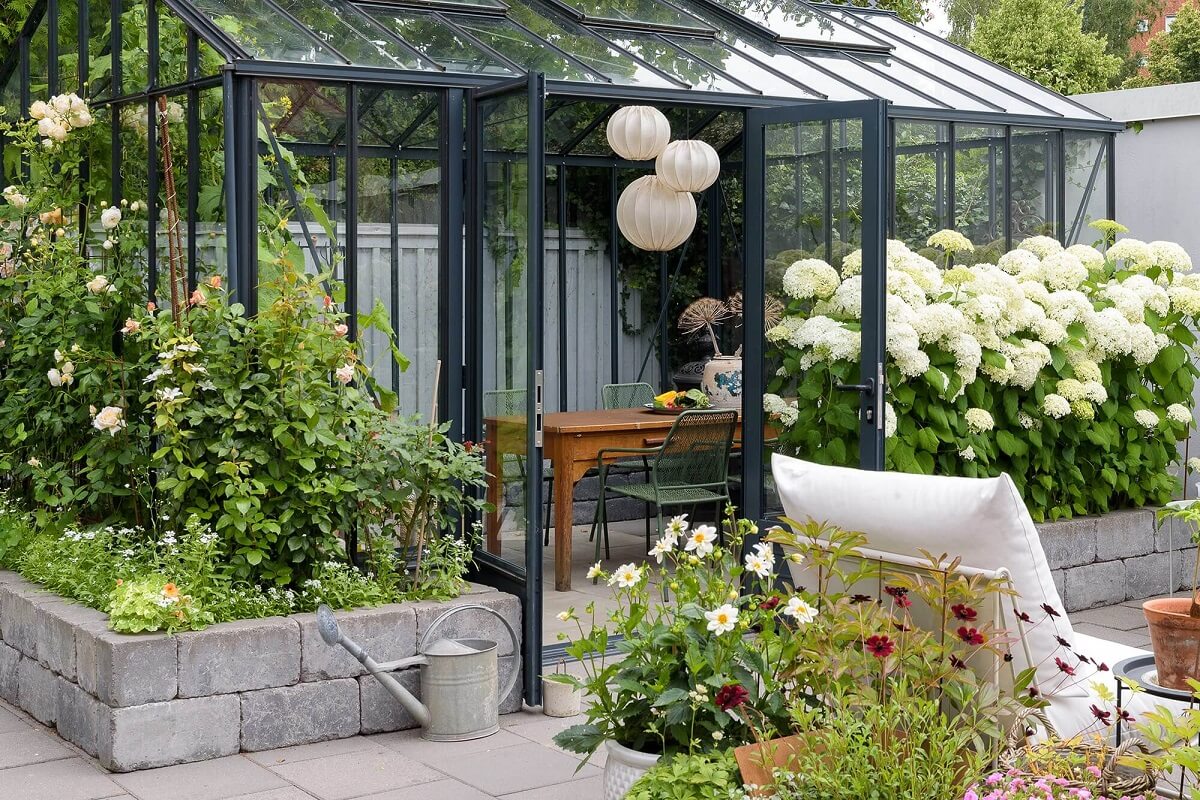 A Beautiful Family Home in a Grand 1930s Villa in Sweden 31 glass house garden A Beautiful Family Home in a Grand 1930s Villa in Sweden