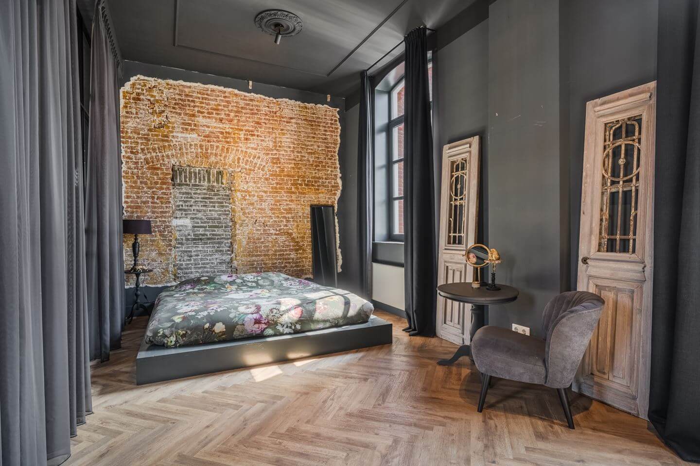 A Beautiful Loft Style Home in a Former Dutch Factory 10 gray bedroom with brick wall