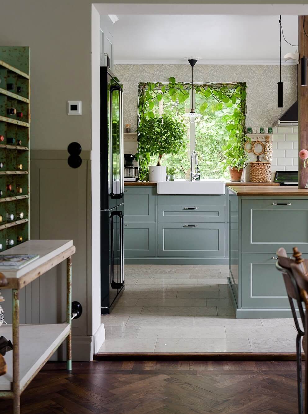 A Beautiful Family Home in a Grand 1930s Villa in Sweden 2 gray green kitchen cabinets