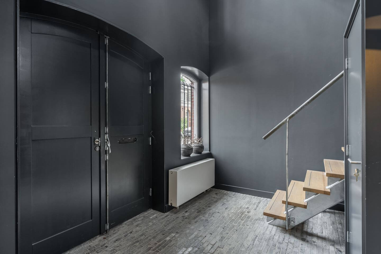 A Beautiful Loft Style Home in a Former Dutch Factory 13 gray hallway
