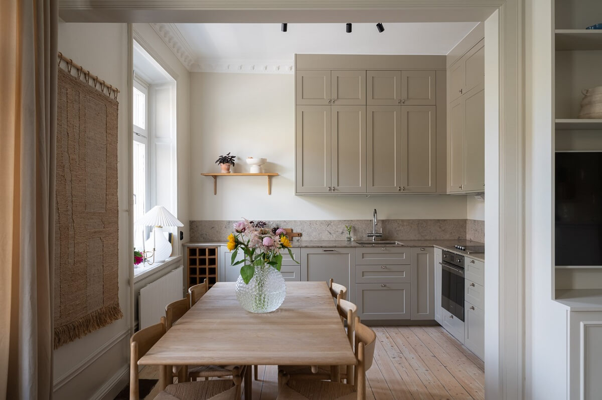 A Renovated Turn-of-the-Century Apartment with Two Bedrooms 8 gray kitchen with dining table