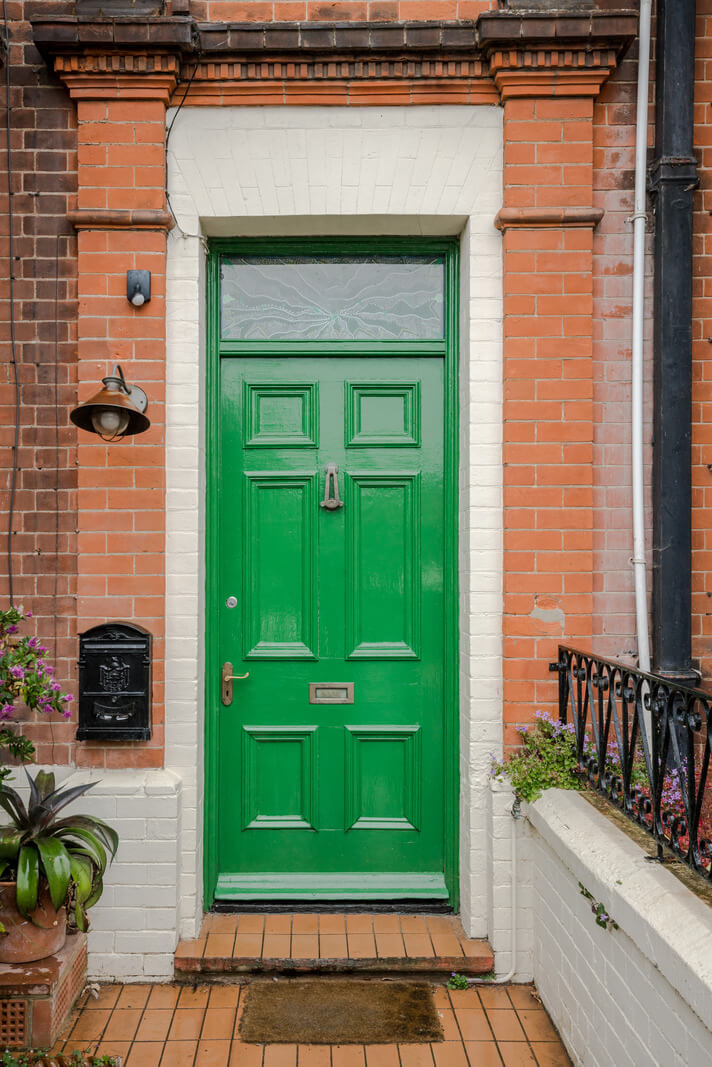 Pared-Back Interiors in a Late Victorian House 20 green front door