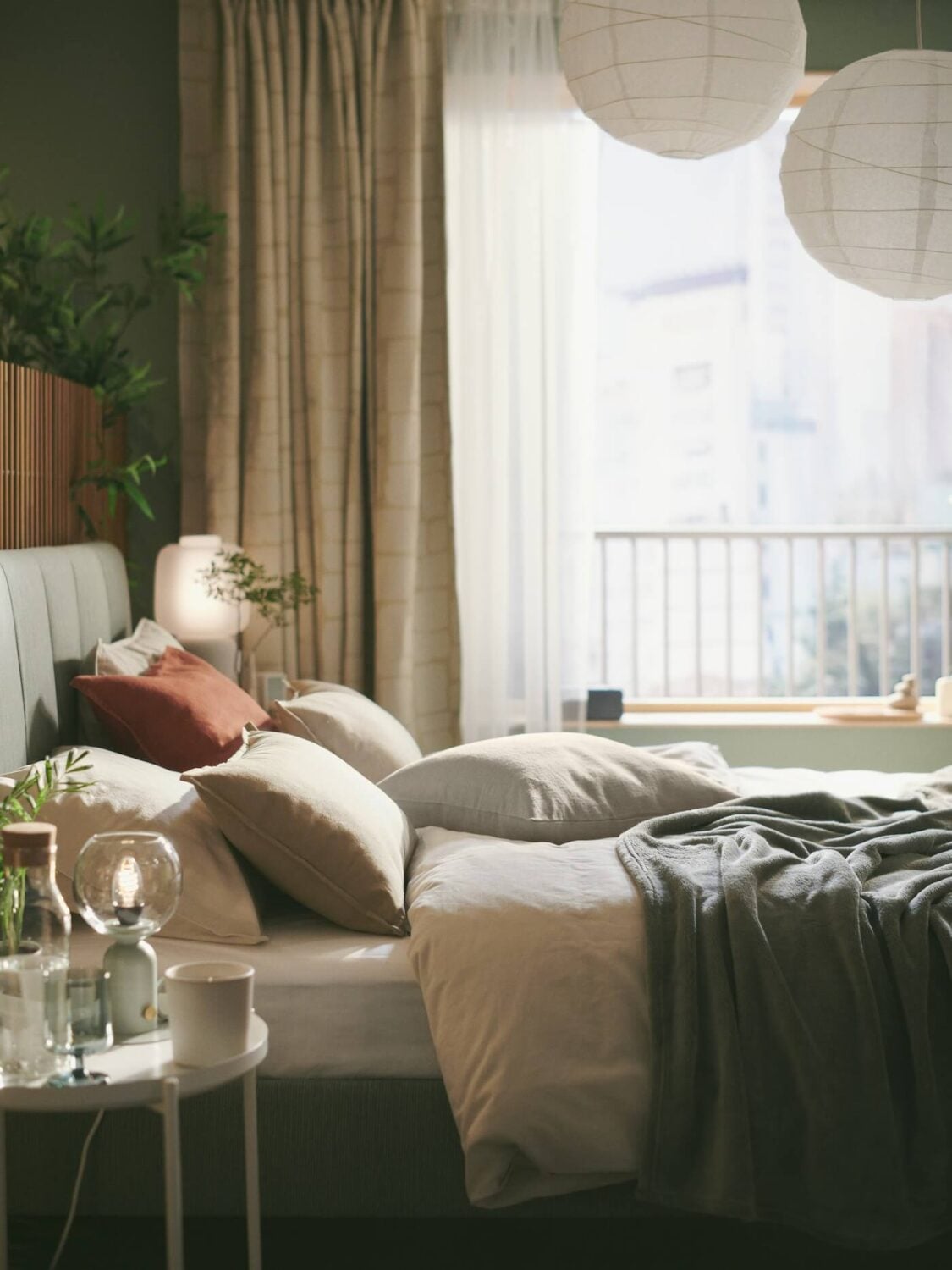 A Sage Green IKEA Bedroom with A Walk-In Closet 3 green ikea bedroom with layered textiles nordroom