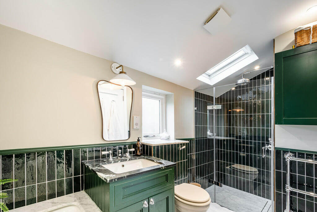 An Open Plan Victorian House with a Lush Green Garden 11 green tiles bathroom An Open Plan Victorian House with a Lush Green Garden