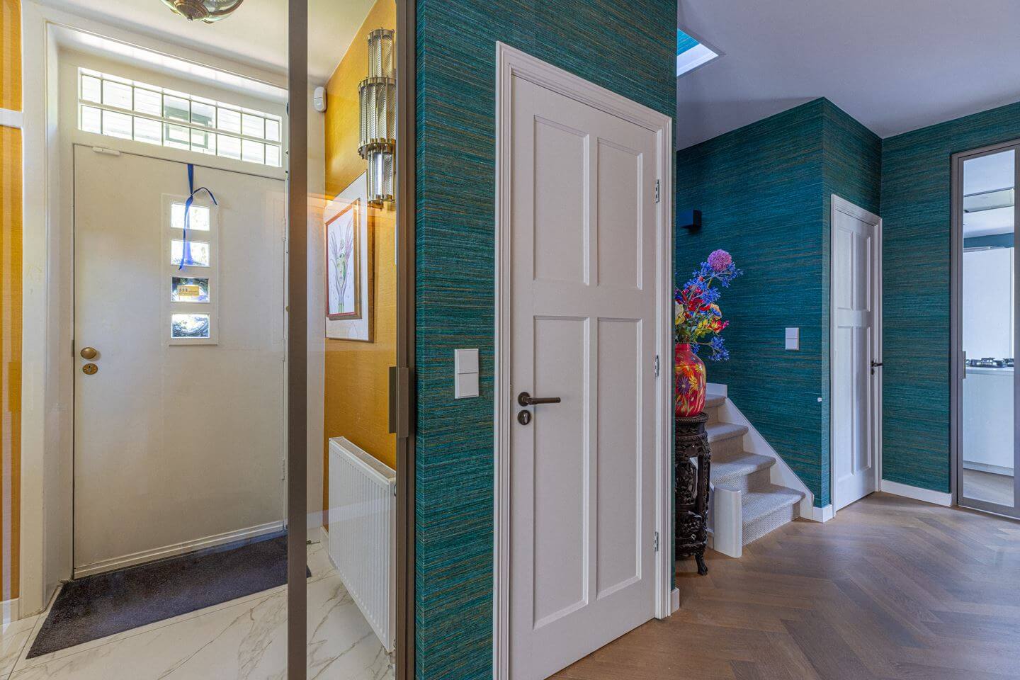 Bold Color Accents in a Dutch Family Home 12 hall green wallpaper