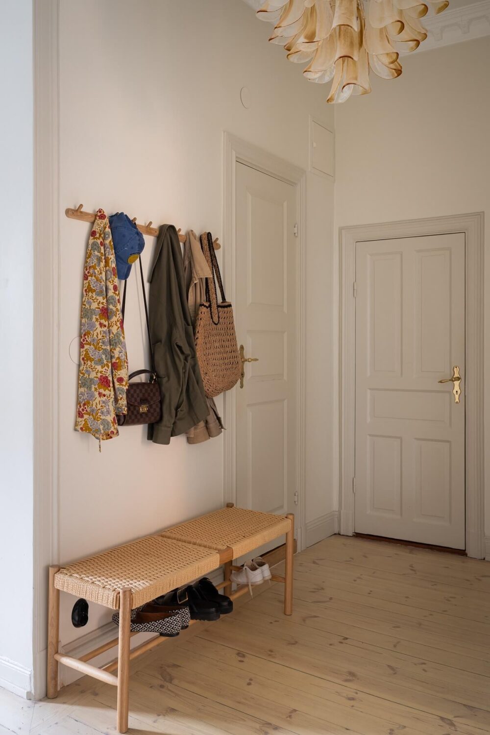 A Renovated Turn-of-the-Century Apartment with Two Bedrooms 24 hallway with bench