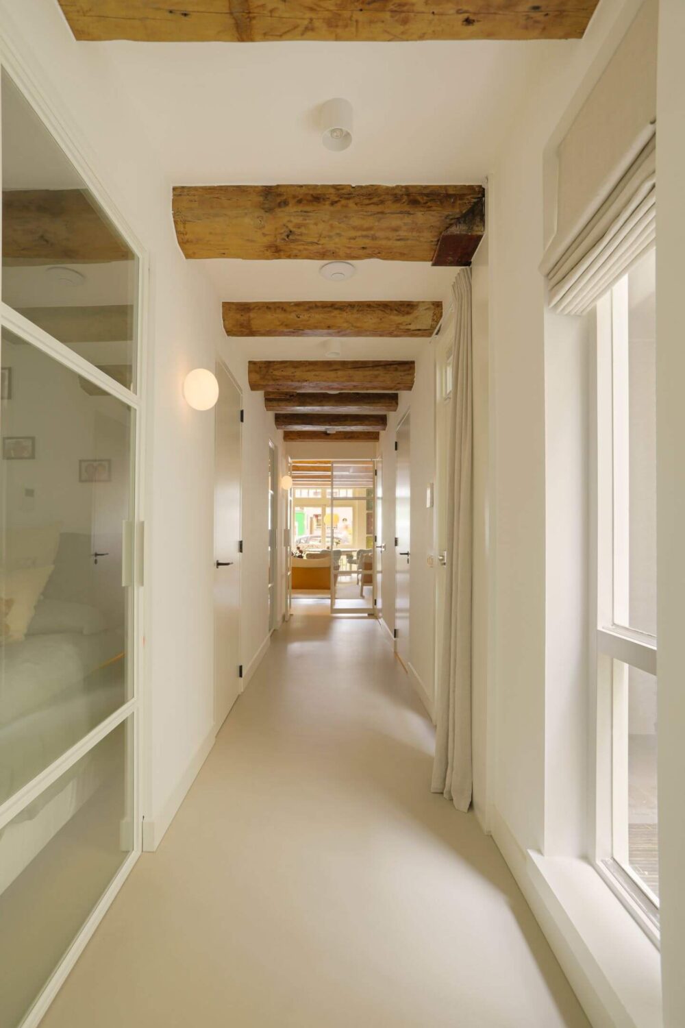 A Modern Apartment in a 17th Century Canal House in Amsterdam 9 hallway with wooden beams