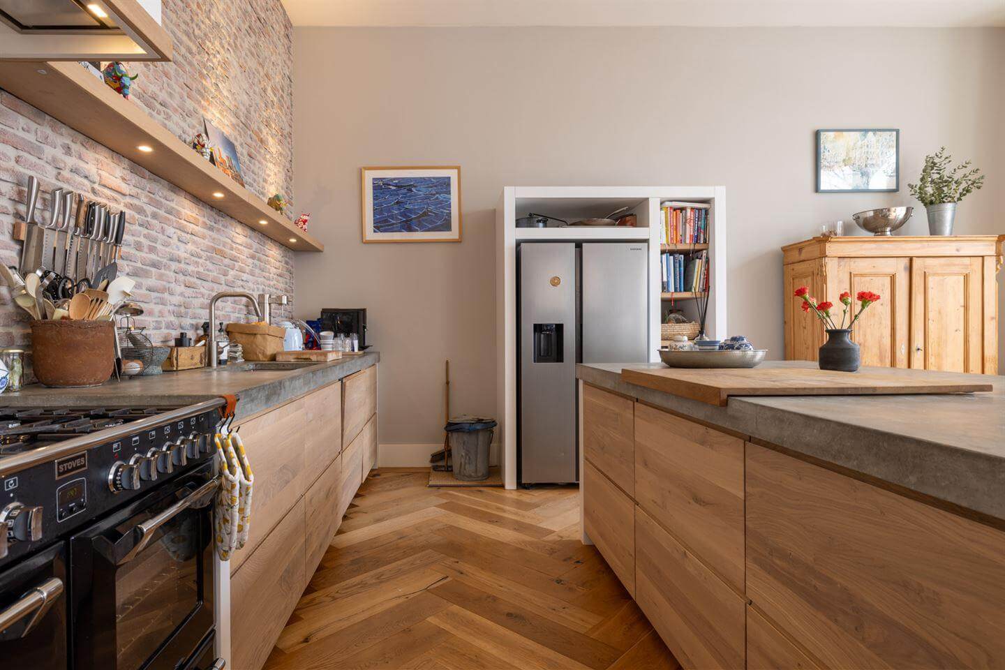 A Modern Duplex Apartment in The Netherlands 6 kitchen brick wall concrete worktop herringbone floor