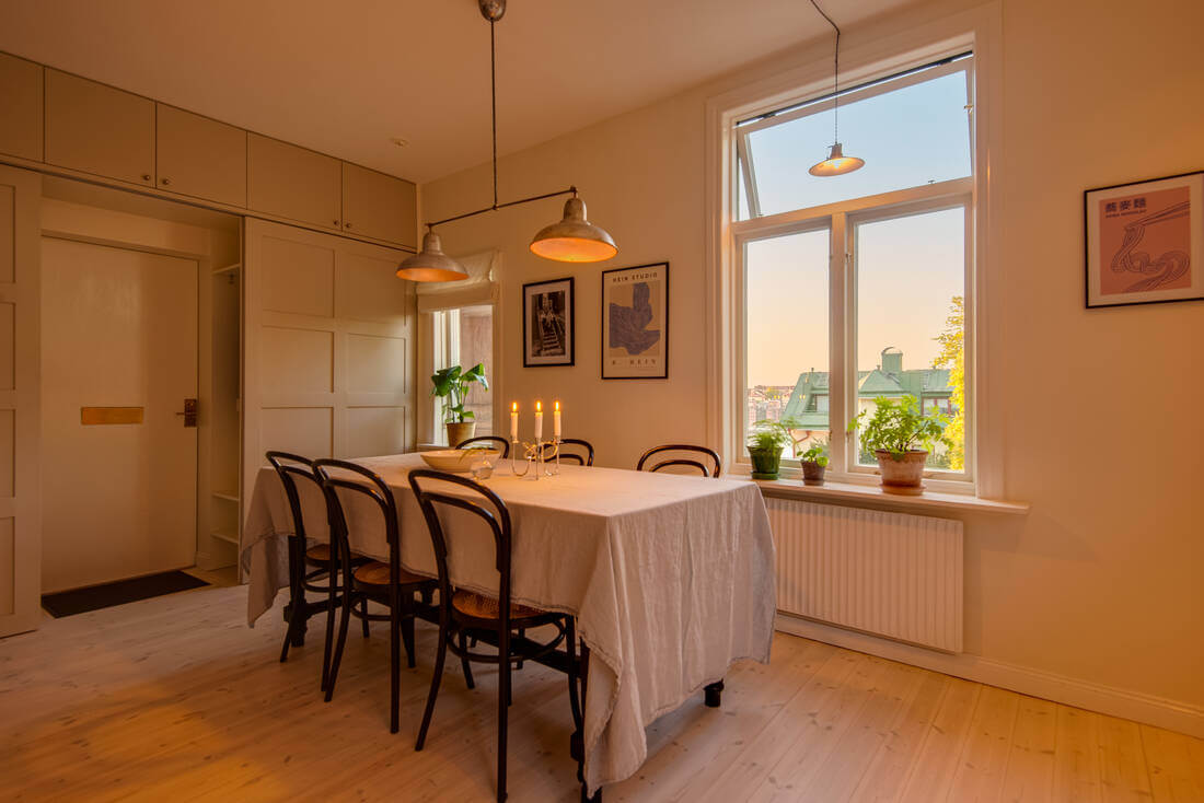 A White Apartment Features a Beautiful Terrace with a View 8 kitchen evening light
