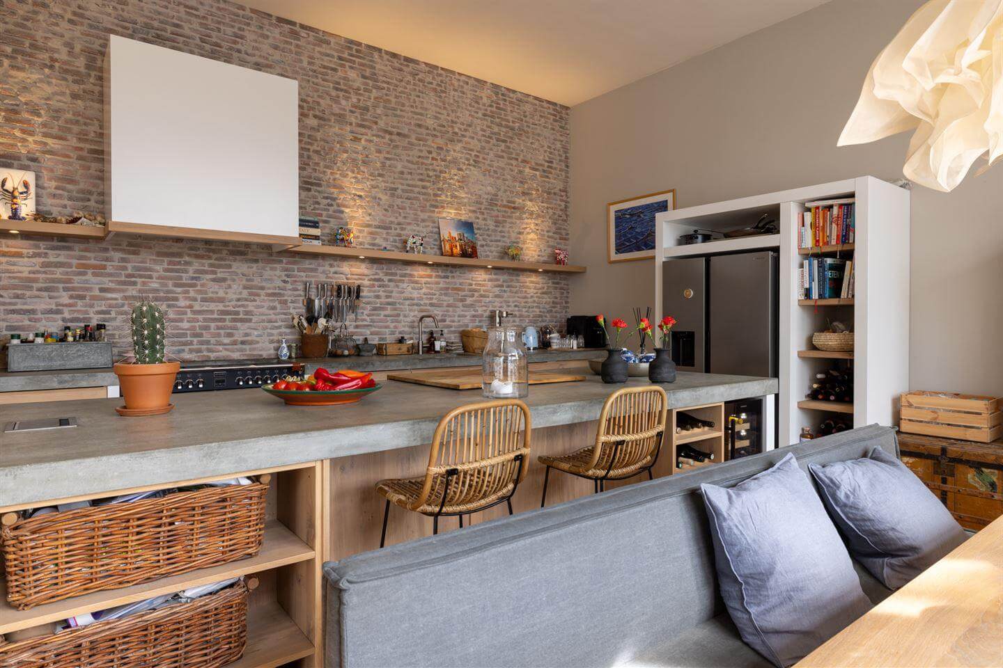 A Modern Duplex Apartment in The Netherlands 5 kitchen island concrete brick wall nordroom