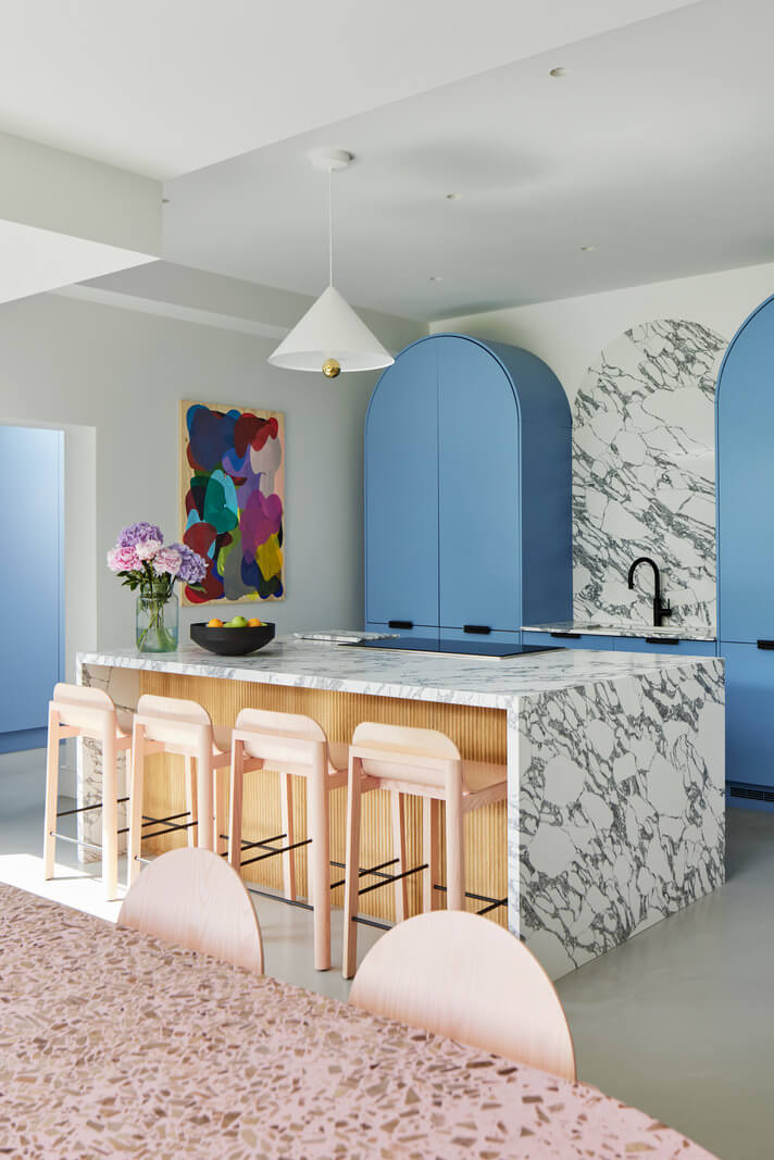 A London Family Home Decorated in Pastel Colors 10 kitchen marble island pastel blue cabinets nordroom